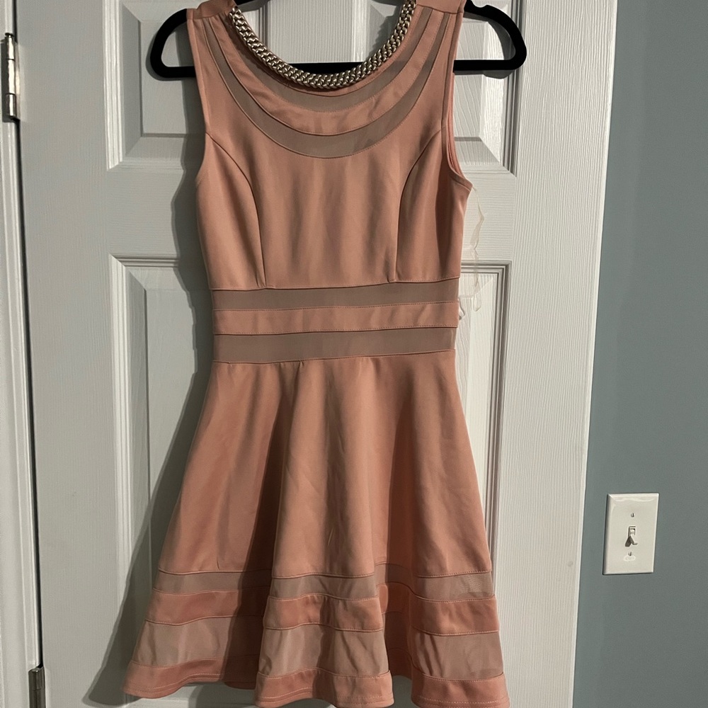 Light pink dress with beaded neck and mesh.